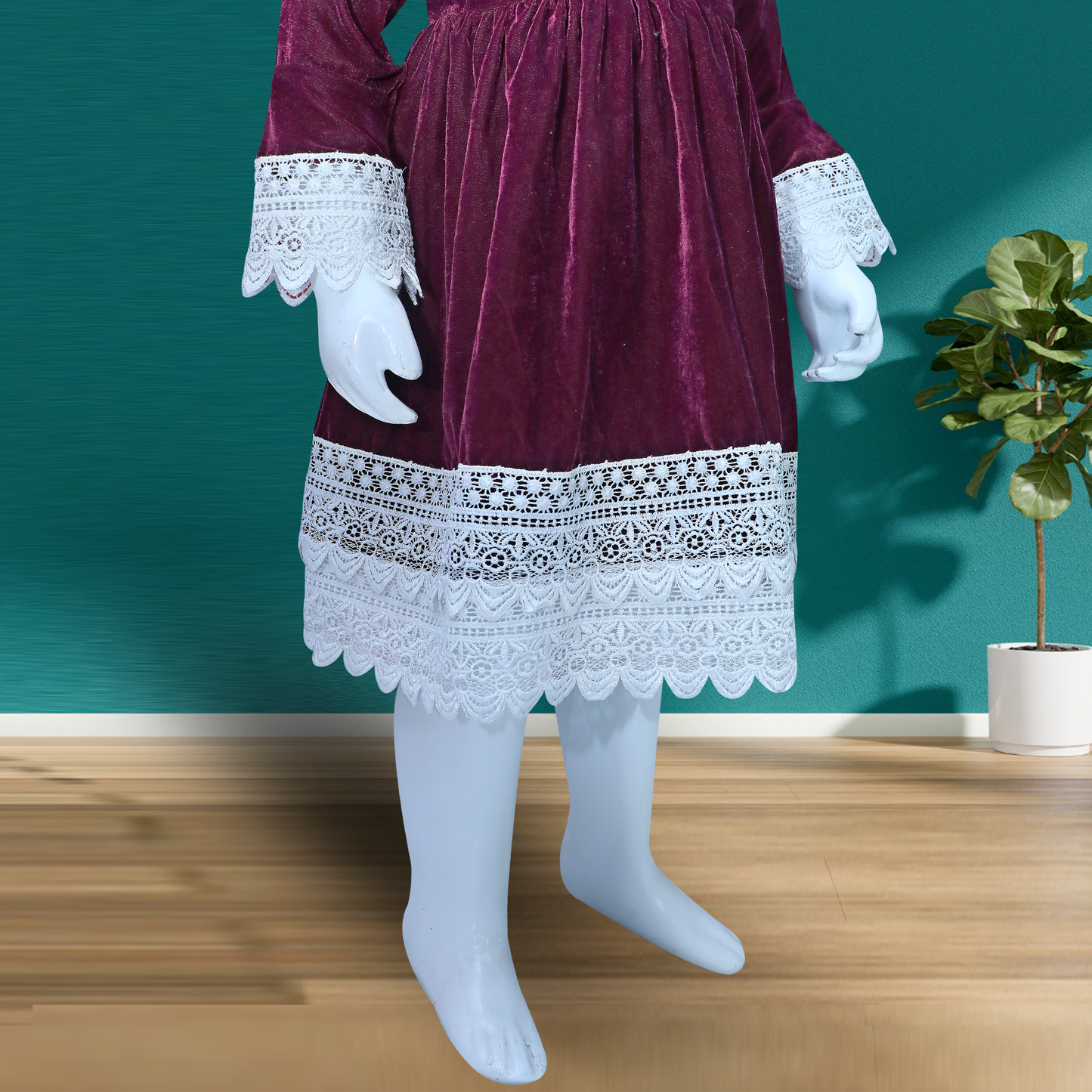 burgundy velvet dress with long sleeves and a flared skirt