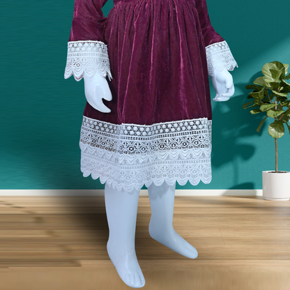 burgundy velvet dress with long sleeves and a flared skirt