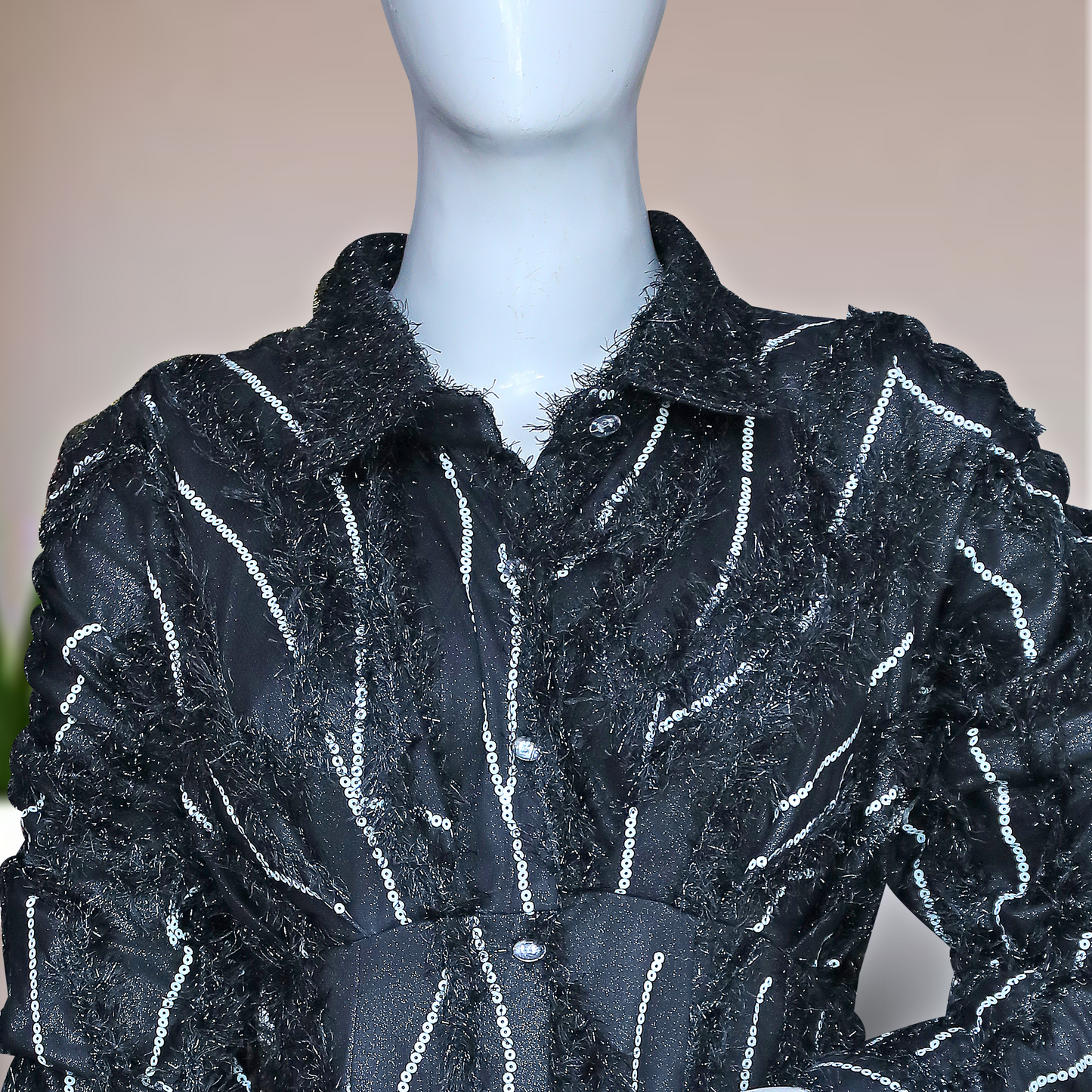 black, long-sleeved shirt dress with white vertical stripes and embellishments