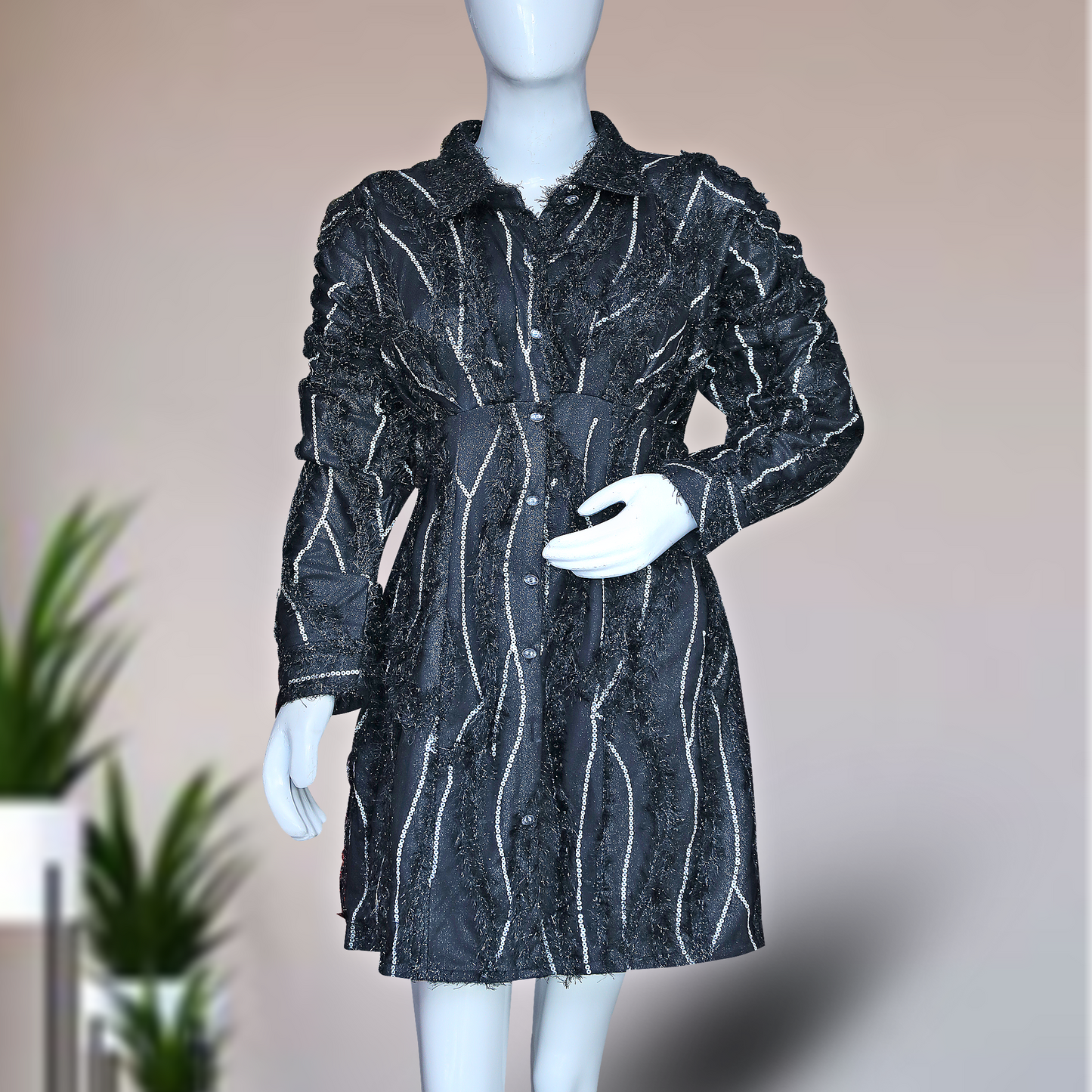 black, long-sleeved shirt dress with white vertical stripes and embellishments