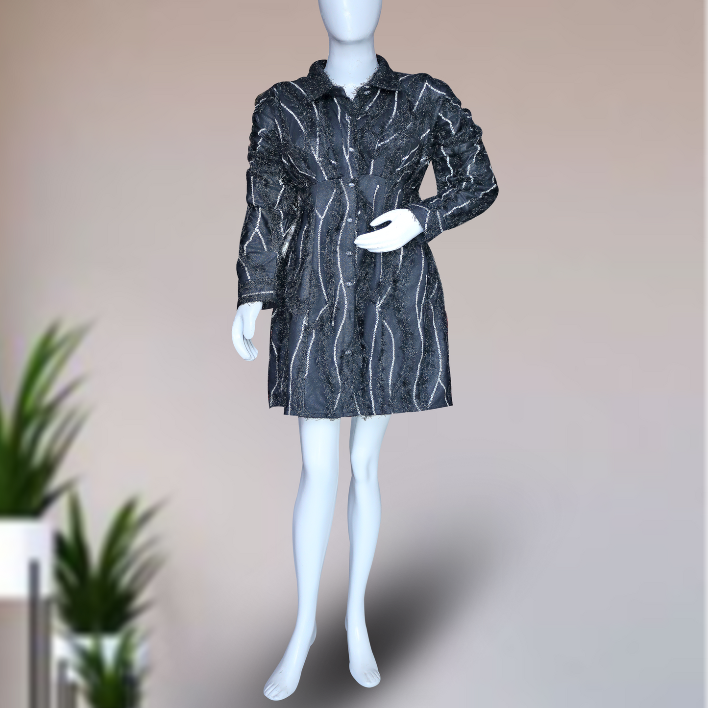 black, long-sleeved shirt dress with white vertical stripes and embellishments