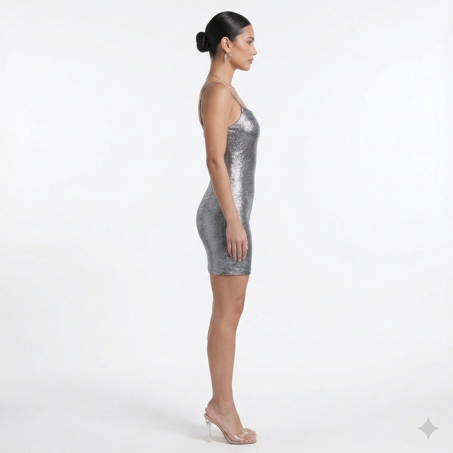 Stunning halterneck bodycon dress adorned with elegant diamante details, featuring a sleek black cowl shape. | cowl shape